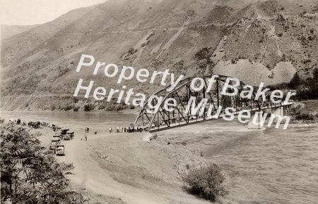 People and cars on bridge