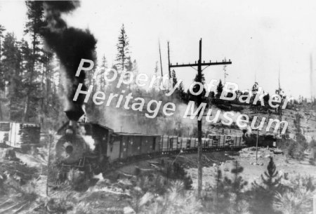 Lumber train after fire in woo