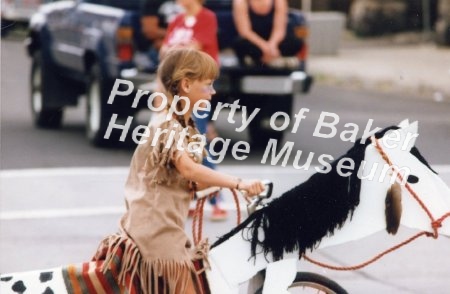 Child on bicycle hobby horse, Jubilee parade