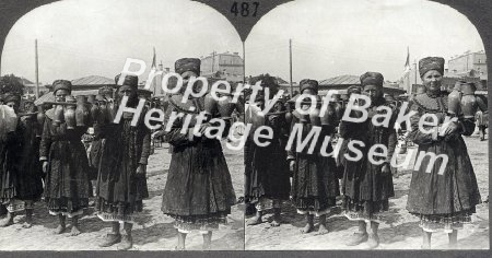 Quaint dairy maids delivering milk in earthenware jars suspended on poles,