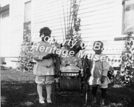 Three brothers & wicker pram,