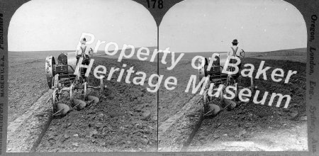 Plowing prairie soil with tractor, S. Dak.