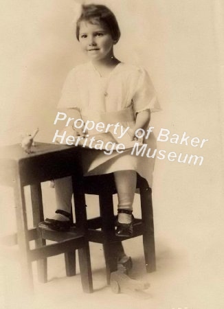 Girl at school desk, ca. 1920