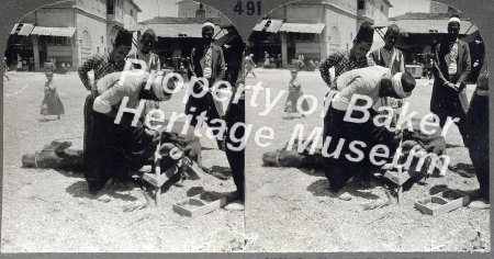 City Blacksmith shoeing buffalo on streets of Tarsus, Syria.