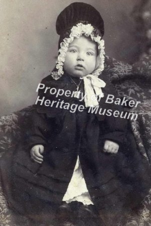 Baby in large bonnet