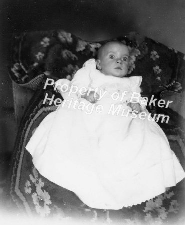 Infant at christening, big eye