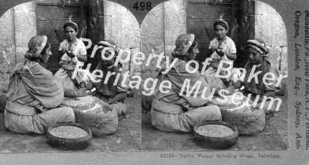 Native women grinding wheat, Palestine.