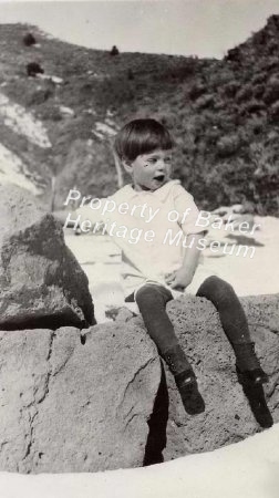 Boy on rock (outdoors