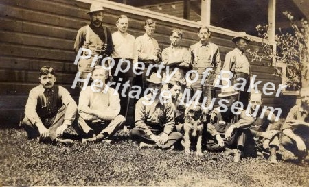 Postcard of 13 men and a dog