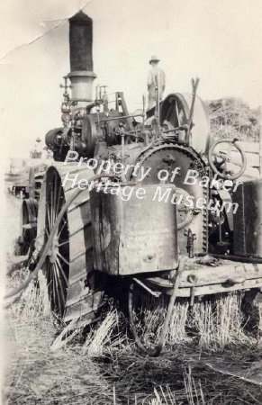 Tractor with box and hoses