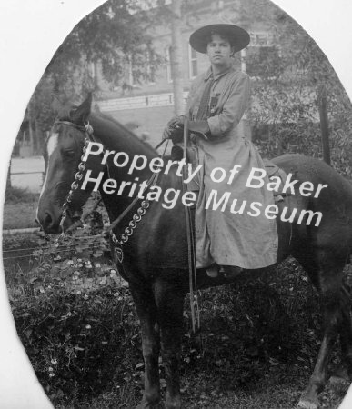 Woman rider in riding habit