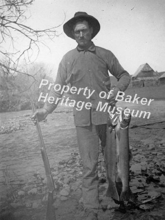 fisherman with steelhead