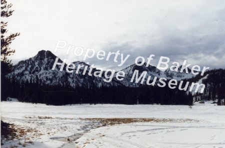 Frozen lake and Gunsight Mt.