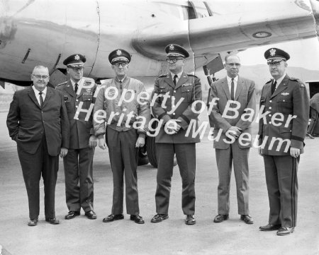 6 dignitaries(4 high ranking Atmy Officers) in front of WWII aircraft at Ba