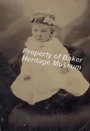 Baby in white dress