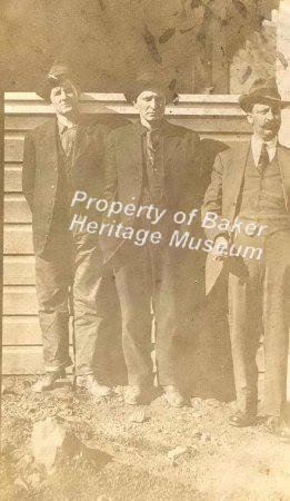 3 men standing by a porch