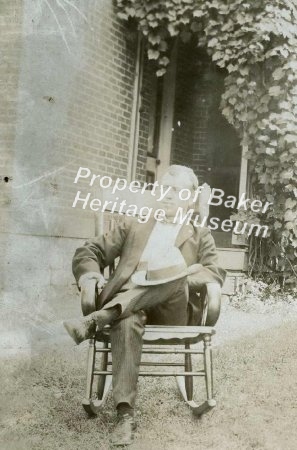 Man in chair in yard